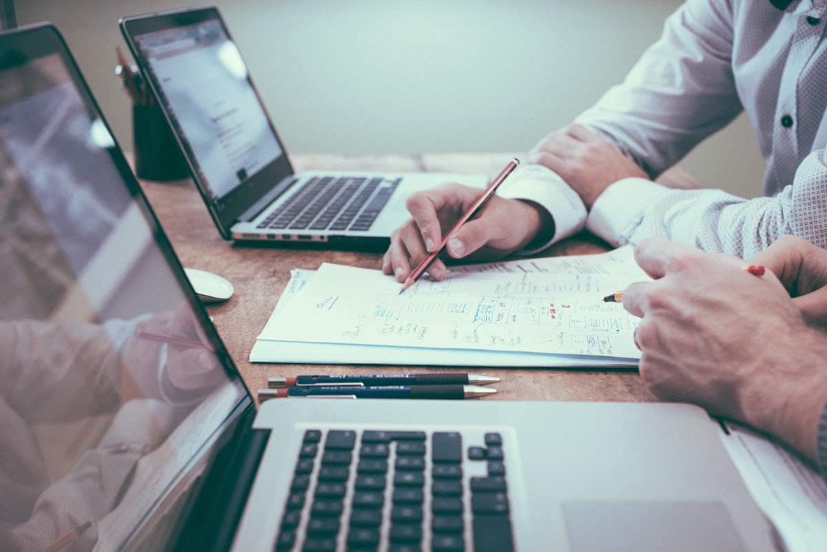 Laptop spreadsheets used to track freelance revenue and expenses